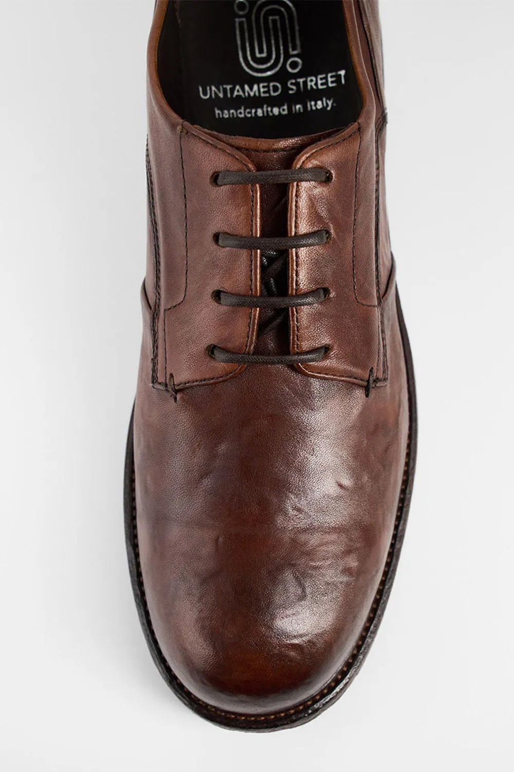 ROWLEY cognac folded derby shoes.